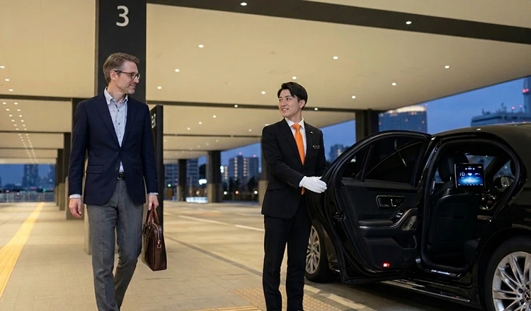 A chauffeur opening the car door for a client.