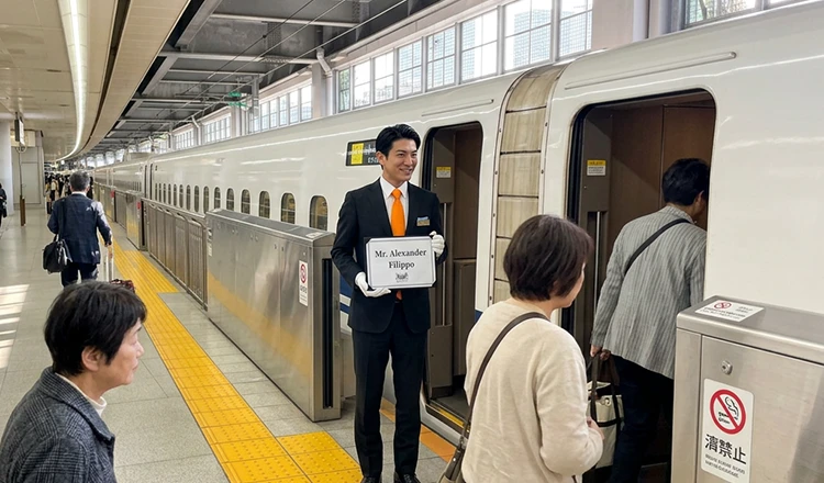 Chauffeur greeting guests on the platform at Tokyo Station